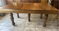 Wood dining table with three leaves