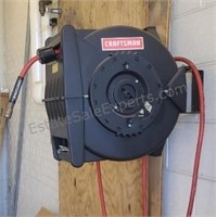 Craftman air hose reel. Includes some air chucks.