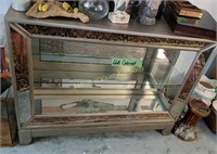 Silver Glass Front Mirrored Cabinet. Items On Top