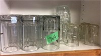 Assorted sizes of glass mugs