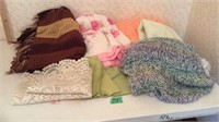 Assorted blankets, napkins, and table runner