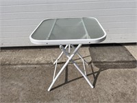 White metal glass top patio side table