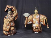 Pair of shelter Asian figures,