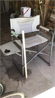 Cabellas folding outdoor chair. Table is cracked,
