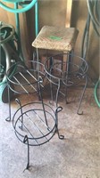 4 metal plant stands.