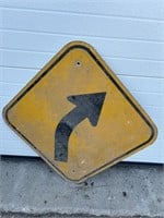 Metal sign: curve ahead