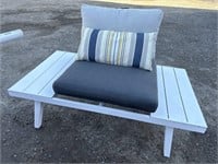 White metal patio settee with cushions