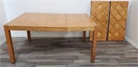 Modern teak dining table with two leaves
