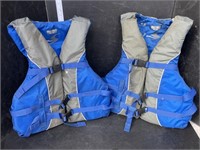 2 blue adult life jackets