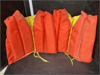 2 Orange life jackets