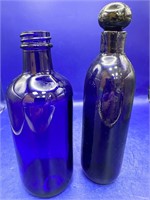 Two Old Blue Glass Bottles one with stopper
