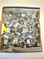 Box of new galvanized pipe straps and fittings