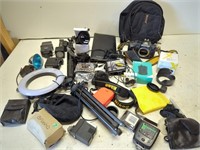 Large box of cameras and camera equipment.