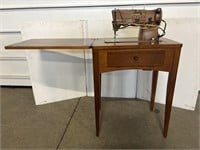 Singer sewing machine in cabinet / stand