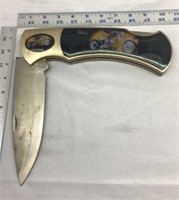 C3)  Large knife with a chopper on it, stainless.