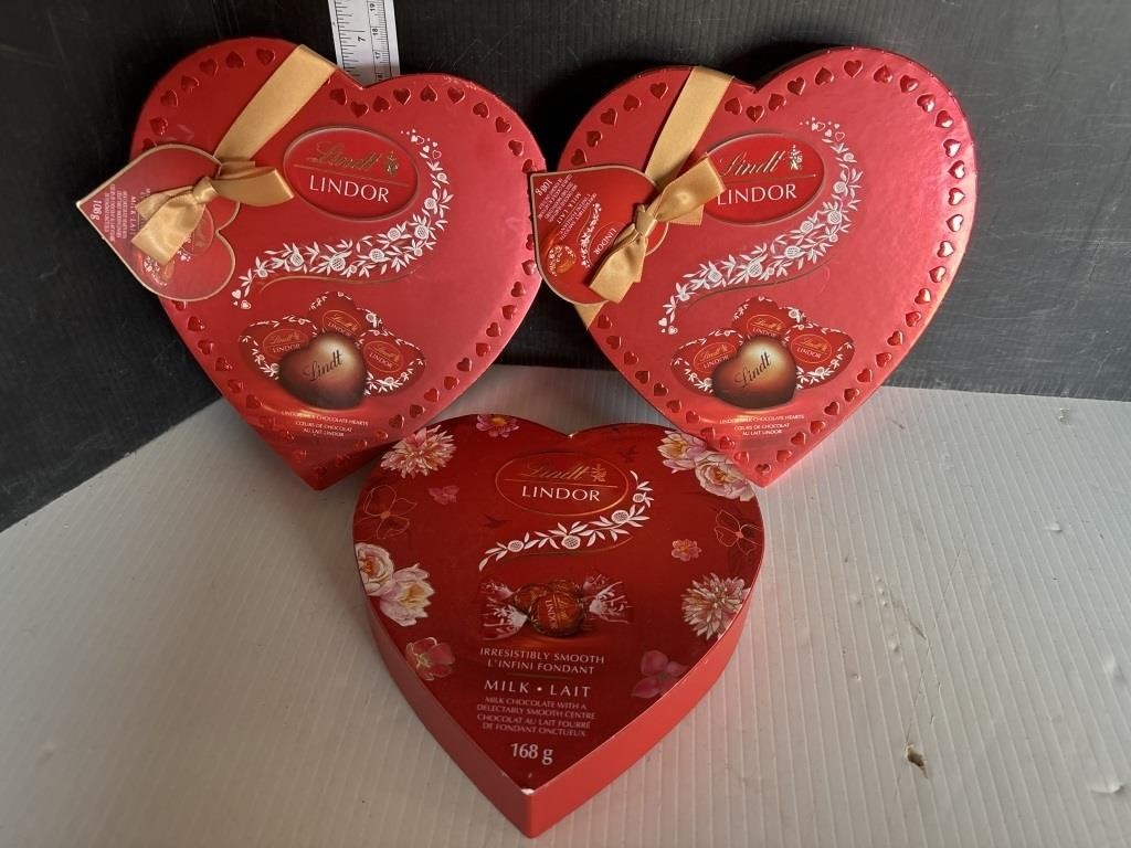 3 red heart shaped boxes of lindor chocolates