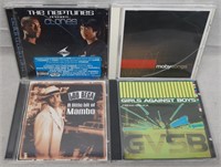 C12) 4 Music CDs The Neptunes Moby Lou Bega