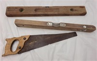 Vintage saw and levels