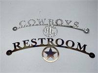 Metal Restroom and Cowboys Signs