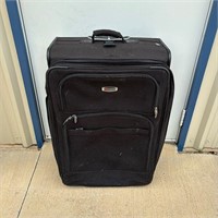 Large Delsey Luggage with Handle and Rollers