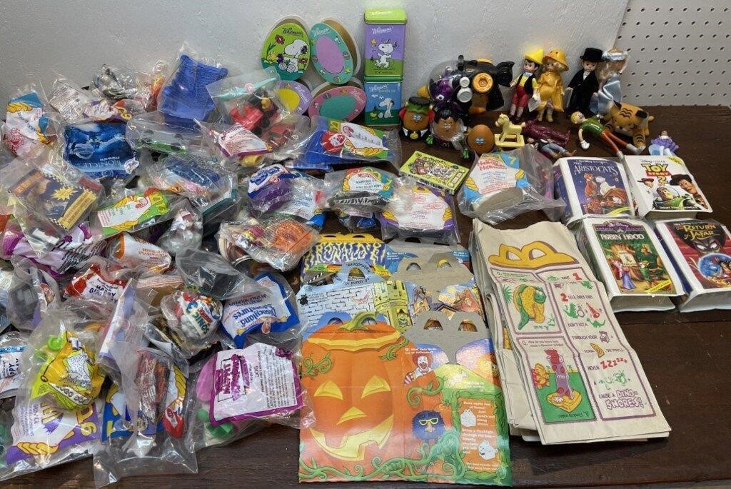 Box of McDonald’s toys and bags, snoopy tins and