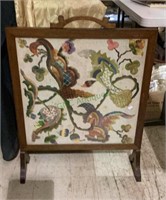 Vintage wooden fireplace screen with a hand