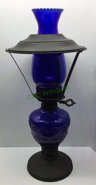 Cobalt blue oil lantern stands 17 inches tall