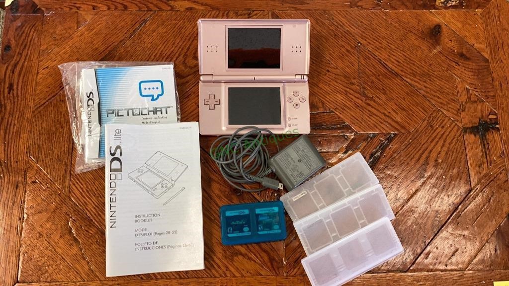 Nintendo DS Lite with charging cord and two