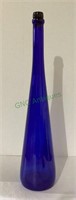 Tall cobalt blue bottle measuring 19 1/2 inches