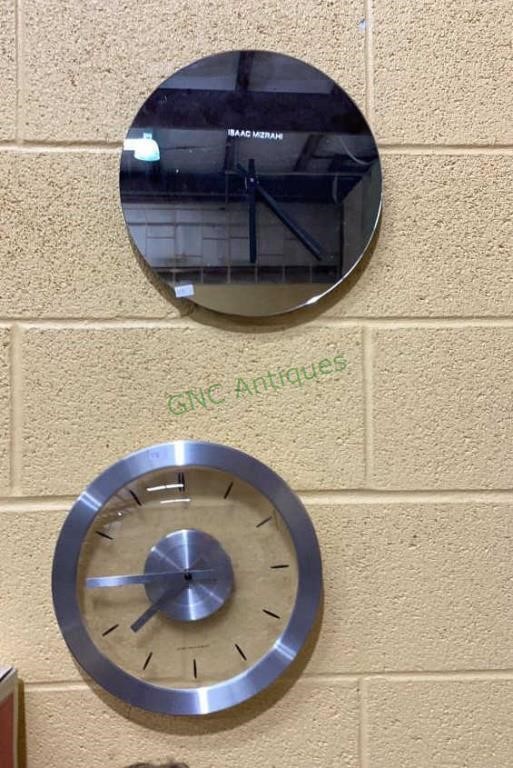 Two unique interesting round wall clocks each