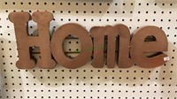 Metal wall hanging that spells out the word home