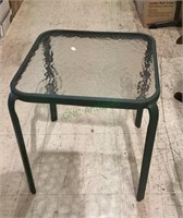 Glass top metal patio side table measures 17x16x16
