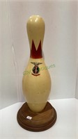 Vintage ABC bowling pin mounted to a wooden