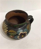 Antique clay hand painted pitcher measuring 5 1/2