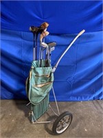Vintage rolling cart golf bag with miscellaneous