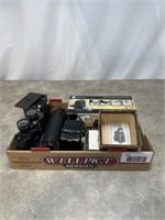 Vintage cameras, Bushnell binoculars, and film