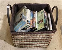 Great two handled decorative basket of DVDs.