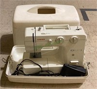 Singer sewing machine in case includes cords and