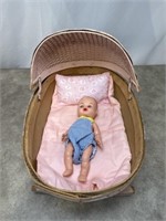 Vintage Baby Doll in a Basket Rocking Bed