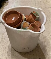 Bucket with a handle contains numerous