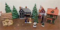 4 ceramic village houses, trees and people