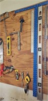 CONTENTS OF PEG BOARD: SAWS, T SQUARE, LEVELS