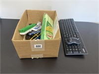 Box of miscellaneous supplies, including keyboard