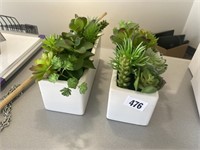 Two glass planters with artificial succulent