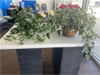 Two artificial plants/baskets