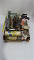 spools of string, hand tools, soldering iron, shop