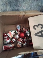 Box of shiny Christmas tree ornaments