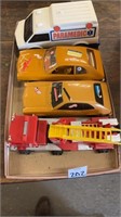 One toy, fire engine, one toy, paramedic truck,