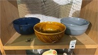 Three ceramic bowls, one chipped