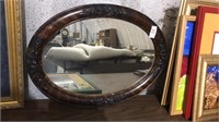 Antique tiger oak oval framed mirror